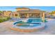 Backyard pool with integrated spa, outdoor kitchen, and covered patio at 7481 E Camino Santo --, Scottsdale, AZ 85260