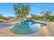 Beautiful pool with textured tile, lounge chairs, and lush landscaping at 7481 E Camino Santo --, Scottsdale, AZ 85260