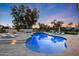 Stunning backyard pool with ample lounge seating and lush landscaping at 7481 E Camino Santo --, Scottsdale, AZ 85260