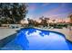 Inviting pool area with lounge seating and lush landscaping perfect for outdoor relaxation and recreation at 7481 E Camino Santo --, Scottsdale, AZ 85260