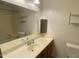 Bathroom featuring a single sink vanity, a medicine cabinet, and a combined tub and shower at 7636 E Coronado Rd, Mesa, AZ 85207