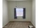 Simple bedroom with carpet, single window with curtains, and plenty of natural light at 7636 E Coronado Rd, Mesa, AZ 85207