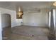 Living room with carpet, staircase and arched entrance at 7636 E Coronado Rd, Mesa, AZ 85207