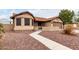 Charming single-story home with a well-maintained front yard at 8576 W Mclellan Rd, Glendale, AZ 85305