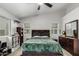 Comfortable main bedroom featuring vaulted ceiling, ceiling fan, windows, carpet, and neutral paint at 8576 W Mclellan Rd, Glendale, AZ 85305