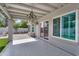 Covered back patio with patterned floor tiles and sliding glass doors at 8781 S Mill Ave, Tempe, AZ 85284