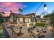 Inviting backyard featuring a fire pit, patio seating, and string lights at 8781 S Mill Ave, Tempe, AZ 85284