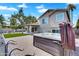 Landscaped backyard features a spa, synthetic grass, an outdoor kitchen and a covered patio at 8781 S Mill Ave, Tempe, AZ 85284