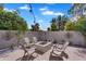 Paver patio featuring a fire pit and adirondack chairs for outdoor entertaining at 8781 S Mill Ave, Tempe, AZ 85284