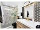 Contemporary bathroom with modern fixtures, stylish tiles, and a glass-enclosed shower at 8781 S Mill Ave, Tempe, AZ 85284