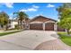 Welcoming home with a palm tree, water fountain, and a three-car garage at 8781 S Mill Ave, Tempe, AZ 85284