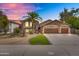 Charming two-story home with a desert landscape, water fountain, and three-car garage at 8781 S Mill Ave, Tempe, AZ 85284