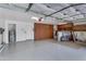 Spacious garage with built-in storage cabinets and epoxy flooring at 8781 S Mill Ave, Tempe, AZ 85284