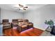 Cozy living room features comfortable seating area with reclining chairs and hardwood flooring at 8781 S Mill Ave, Tempe, AZ 85284