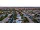 Expansive aerial view of a residential neighborhood with tree-lined streets and mountain views in the distance at 9523 W Sandstone Dr, Sun City, AZ 85351