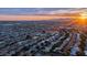 Gorgeous aerial shot capturing suburban community with sunset skies and mountain range in the background at 9523 W Sandstone Dr, Sun City, AZ 85351