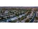 Expansive aerial view of a residential neighborhood with tree-lined streets and mountain views in the distance at 9523 W Sandstone Dr, Sun City, AZ 85351