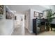 Hallway with tile flooring, storage cabinet, neutral paint and decor at 9523 W Sandstone Dr, Sun City, AZ 85351