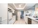 Bright kitchen featuring modern stainless steel appliances, white cabinets, and clean countertops at 9523 W Sandstone Dr, Sun City, AZ 85351