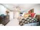 Cozy primary bedroom featuring a ceiling fan, soft carpet, and large closet at 9523 W Sandstone Dr, Sun City, AZ 85351