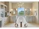 Bright bathroom with a soaking tub, dual vanity sinks, and an abundance of natural light at 10040 E Happy Valley Rd # 269, Scottsdale, AZ 85255