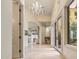 Inviting hallway with tile floors, natural light and views of the living spaces at 10040 E Happy Valley Rd # 269, Scottsdale, AZ 85255