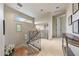 Upstairs hallway with wrought iron railing and hardwood stairs at 10040 E Happy Valley Rd # 269, Scottsdale, AZ 85255