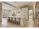 Open-concept kitchen with a large center island, white cabinetry, and seamless access to the dining and living areas at 10040 E Happy Valley Rd # 269, Scottsdale, AZ 85255