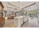 Open-concept kitchen features an island with white cabinetry, countertops, and stainless steel appliances at 10040 E Happy Valley Rd # 269, Scottsdale, AZ 85255