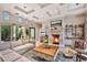 Cozy living room with stone fireplace, coffered ceilings and access to private courtyard at 10040 E Happy Valley Rd # 269, Scottsdale, AZ 85255