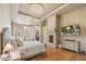 The main bedroom offers a seating area with a fireplace and beautiful wood flooring at 10040 E Happy Valley Rd # 269, Scottsdale, AZ 85255