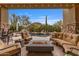 Luxurious outdoor living area with a fire pit, comfortable seating, a pool, and desert views at 10040 E Happy Valley Rd # 269, Scottsdale, AZ 85255