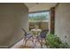 Charming outdoor patio featuring stone accents, a water fountain, and a cozy seating area for relaxation at 10040 E Happy Valley Rd # 269, Scottsdale, AZ 85255