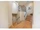 Elegant staircase featuring wood treads, an ornate metal railing, and a landing with decorative details at 10040 E Happy Valley Rd # 269, Scottsdale, AZ 85255