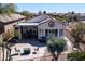 Aerial view of a charming backyard with a patio, desert landscaping and outdoor seating areas at 10134 E Meandering Trail Ln, Gold Canyon, AZ 85118