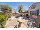 Desert-landscaped backyard with a stone patio, mountain views and a covered patio at 10134 E Meandering Trail Ln, Gold Canyon, AZ 85118