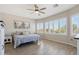 Spacious bedroom filled with natural light, featuring tile floors and large windows at 10134 E Meandering Trail Ln, Gold Canyon, AZ 85118