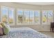Bedroom featuring a large window with bright natural light, plantation shutters and mountain views at 10134 E Meandering Trail Ln, Gold Canyon, AZ 85118