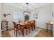 Dining room showcases wood table and chairs, designer light fixture, and natural light at 10134 E Meandering Trail Ln, Gold Canyon, AZ 85118