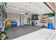 Organized garage space with built-in storage cabinets and a clean, concrete floor at 10134 E Meandering Trail Ln, Gold Canyon, AZ 85118