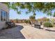 Spacious patio with a seating area, fire pit and desert landscaping creating a relaxing outdoor living space at 10134 E Meandering Trail Ln, Gold Canyon, AZ 85118