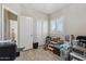 Multipurpose room with wood floors, a window, a closet, and a variety of items at 10134 E Meandering Trail Ln, Gold Canyon, AZ 85118