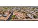 Suburban neighborhood with neatly lined homes, driveways, and tree-lined streets, captured from an aerial perspective at 1031 W Cornell Dr, Tempe, AZ 85283