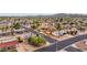 Scenic aerial view of a residential area highlighting tree-lined streets, diverse architecture, and mountain views at 1031 W Cornell Dr, Tempe, AZ 85283