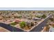 Aerial view of a neighborhood featuring diverse home styles, manicured landscaping, and solar panels on multiple residences at 1031 W Cornell Dr, Tempe, AZ 85283