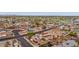 Aerial view of a community with diverse home designs, palm trees, and well-maintained lawns in a suburban setting at 1031 W Cornell Dr, Tempe, AZ 85283