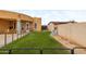 This backyard has turf, a fountain and is fully enclosed with fencing at 1031 W Cornell Dr, Tempe, AZ 85283