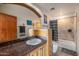 Bathroom features a vanity with granite countertop and shower-tub combo at 1031 W Cornell Dr, Tempe, AZ 85283
