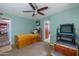 This room features a single bed, wooden floors and a chair by the window at 1031 W Cornell Dr, Tempe, AZ 85283