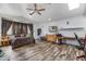 Spacious bedroom features wood floors, ceiling fan and large windows at 1031 W Cornell Dr, Tempe, AZ 85283